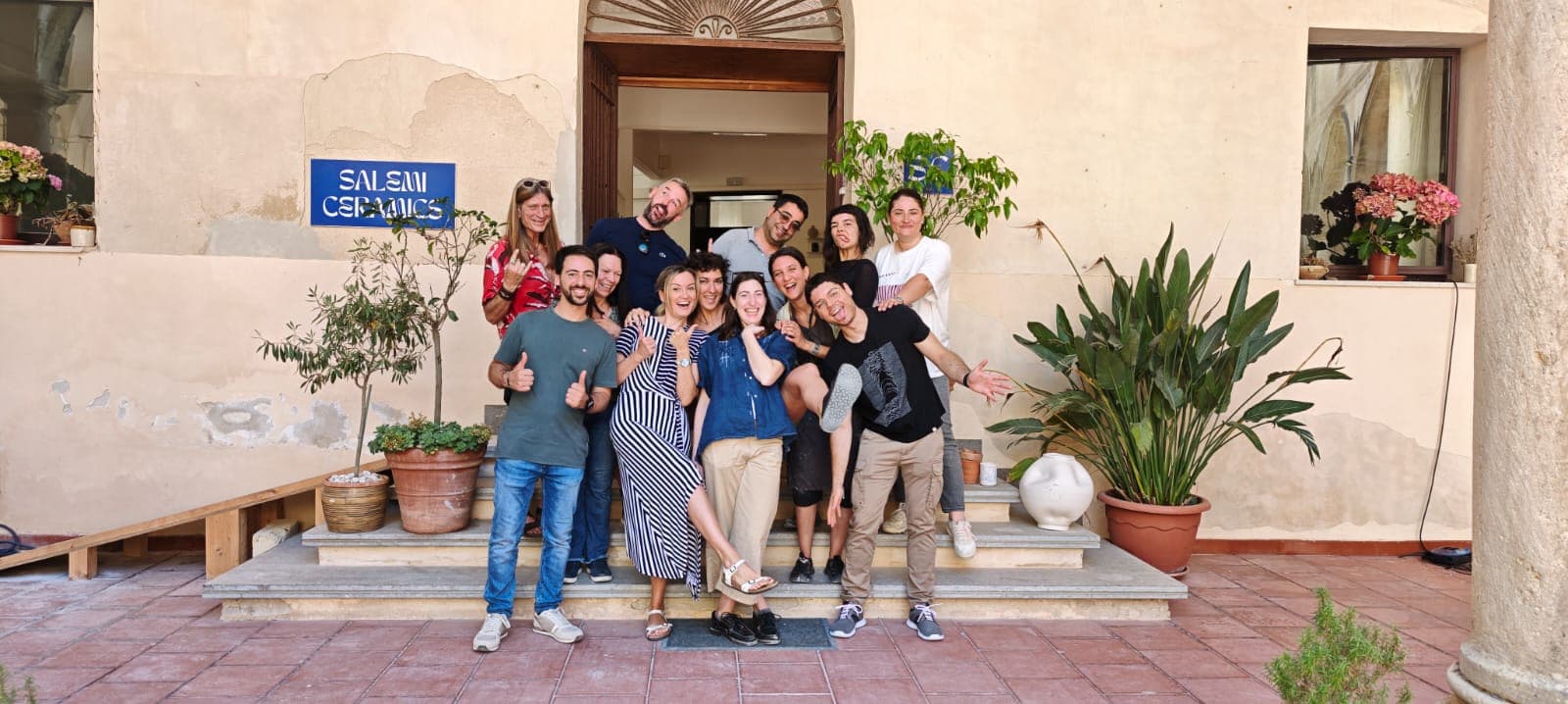 The Salemi Ceramics team at the studio entrance